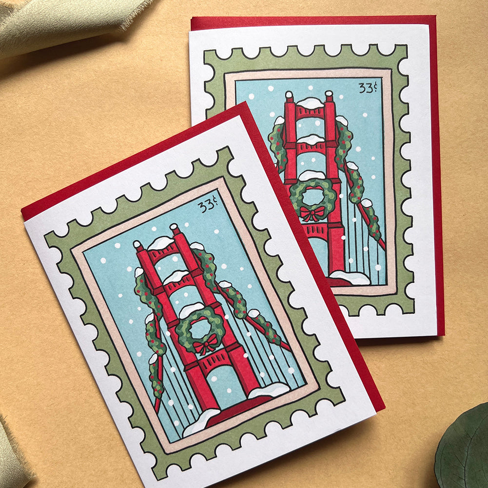 Two greeting cards with Golden Gate Bridge design on a beige background