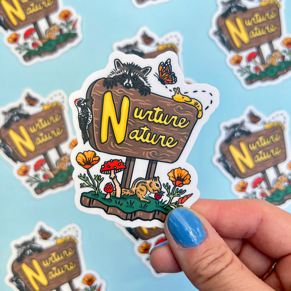 Sticker with 'Nurture Nature' text held by a hand on a light blue background with more stickers.