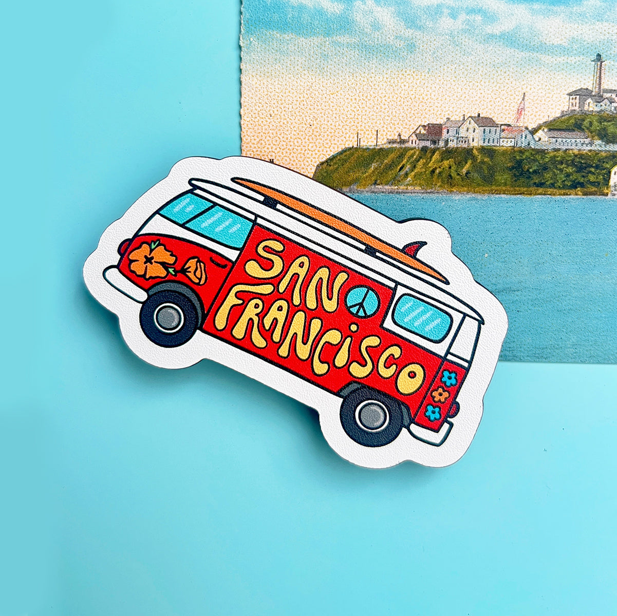 Sticker of a red van with 'San Francisco' text on a blue background
