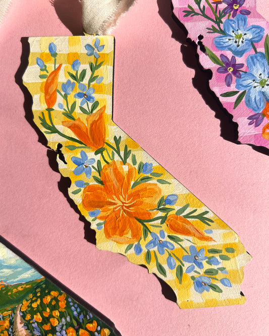 California with painted floral design on a pink background