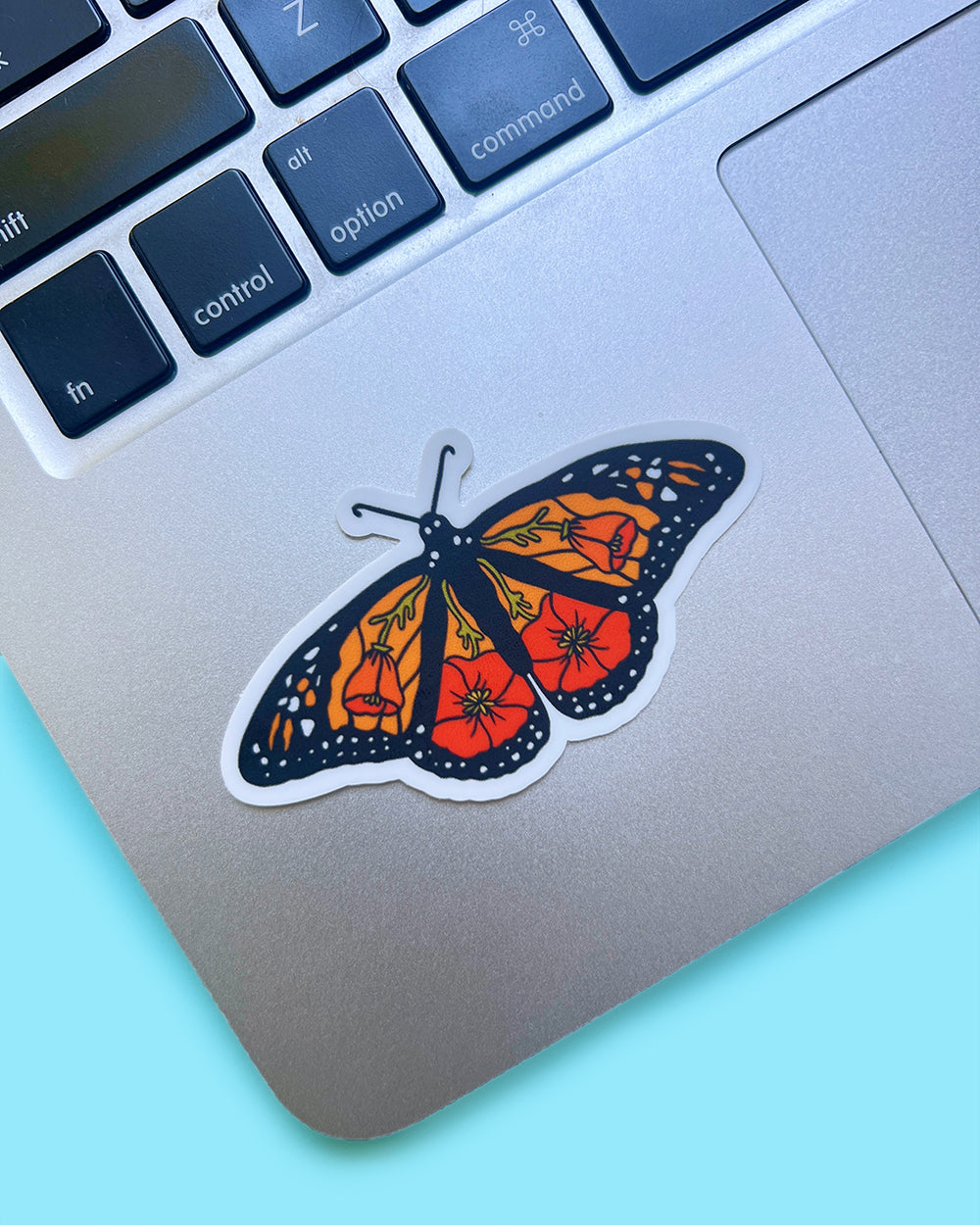 California monarch poppy butterfly sticker on a laptop to show scale and usage option.