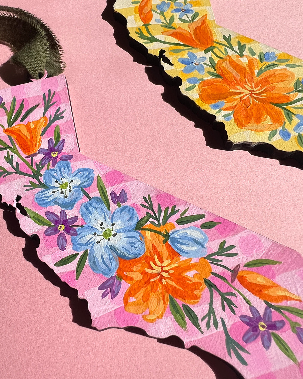 Floral-patterned product on a pink background