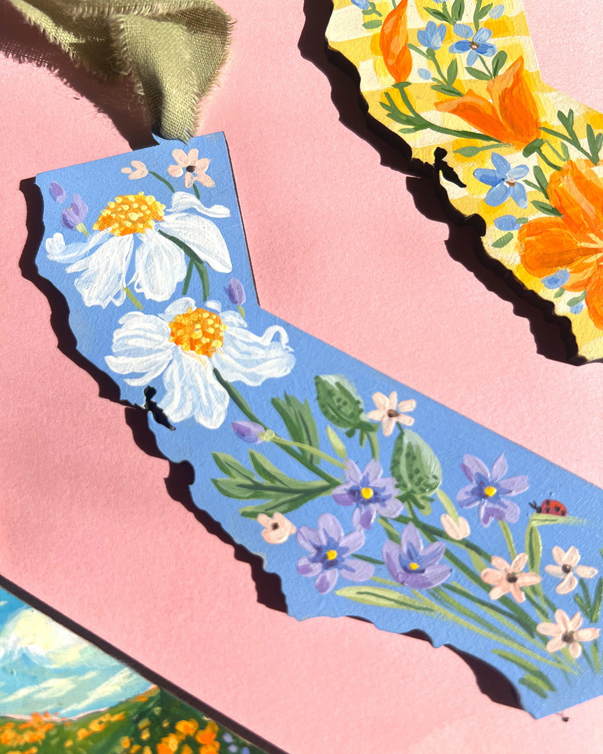 Colorful floral California paintings on a pink background