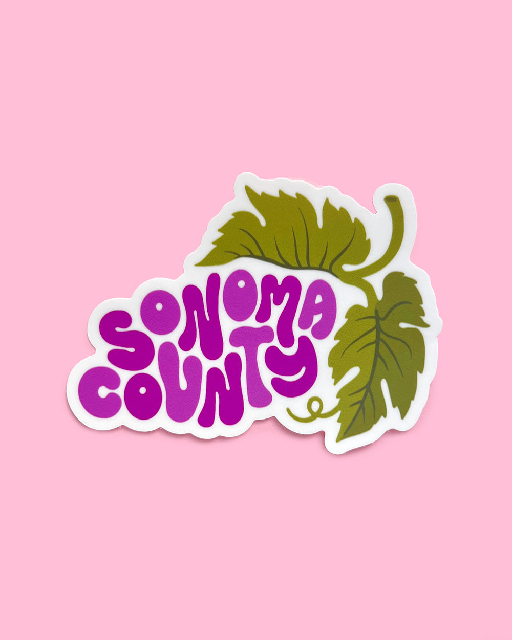 Sonoma County Wine Country Grape sticker on a pink background.